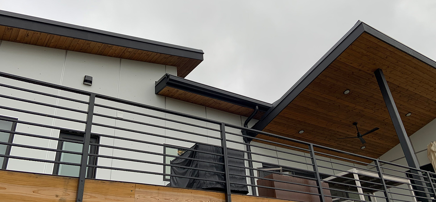 view from below of deck and roof with gutter golena mo